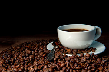 White coffee mug  and coffee beans on the dark wooden background - image