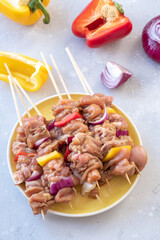 Homemade Raw Chicken Shish Kebabs with Peppers and Onions