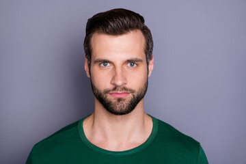 Obraz premium Closeup photo of macho attractive guy perfect appearance neat groomed hairdo bristle not smiling clever eyes wear casual green t-shirt isolated grey color background