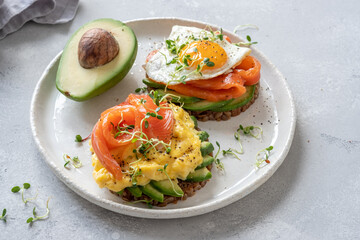Scrambled eggs with smoked salmon and avocado on toast , Breakfast food