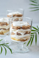 Banana caramel parfait trifle desserts with fresh whipped cream and chocolate cookie crumbles