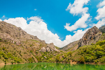 Mountain lake, large stone in foreground