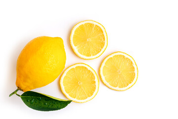 Fresh organic yellow lemon fruit with slices and green leaves isolated on white background . Top view. Flat lay.