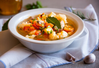 Vegetable soup with cauliflower, laurel and other vegetables