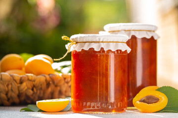 Homemade apricot jam. In the garden. 
