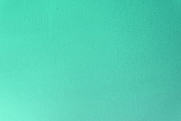 Aqua menthe or neo mint colour on recycled organic paper for the environment to be use as a background.