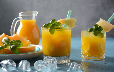 Refreshing drinks and citrus juices  with ice cubes, mint and watermelon. Summer concept 