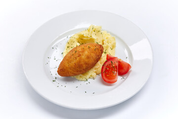 cutlet with mashed potato and tomato