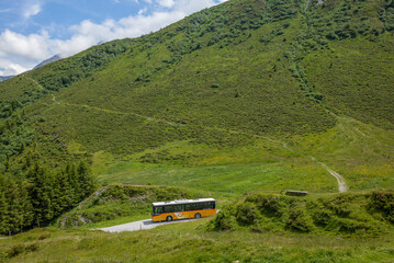 Glas Pass, SWITZERLAND - July 4, 2020: A typical Swiss Postal bus (