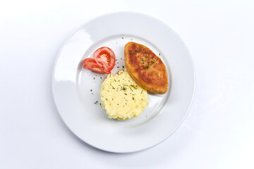 cutlet with mashed potato on white plate