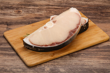 Raw shark steak served rosemary