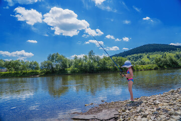 Cute little girl is fishing. Summer vacation, healthy lifestyle, sport concept.