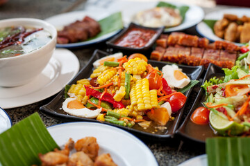 Thai food, Spicy Corn and mixed fruit salad on table