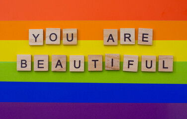 LGBT pride. Lesbian Gay Bisexual Transgender. LGBT, you are beautiful letters on the LGBT flag. The concept of rainbow love. Human rights and tolerance. Poster, postcard, banner and background.