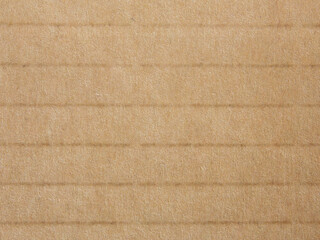 Fototapeta premium Striped cardboard texture background. Brown recycled packaging cardboard with horizontal stripes.