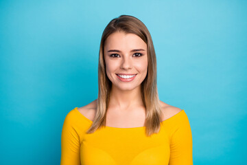 Close-up portrait of her she nice attractive lovely cute lovable pretty cheerful cheery lucky girl wearing yellow pullover isolated over bright vivid shine vibrant blue color background