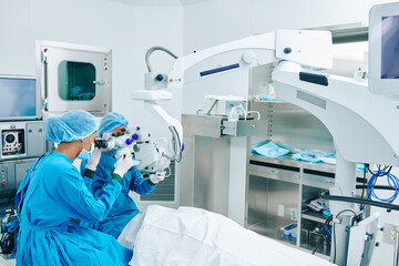 Surgeons performing laser eye vision correction in clinic