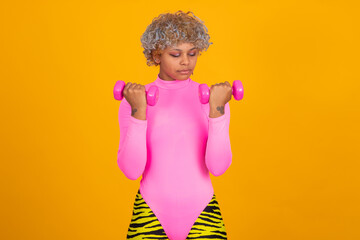 girl or woman in sportswear doing dumbbell gymnastics