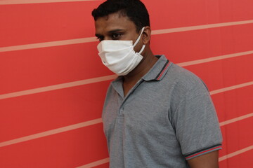 young man with mask face closeup