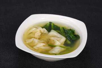Asian traditional Wonton soup with herbs