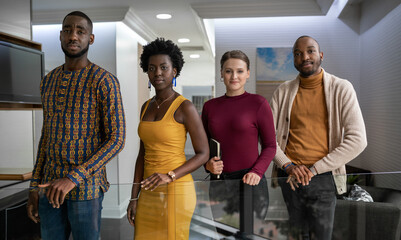 Confident group of diverse young businesspeople standing in an office