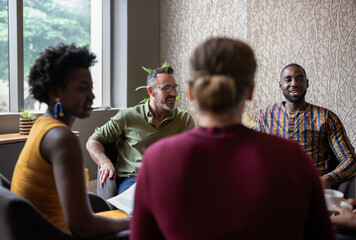 Smiling group of diverse businesspeople having a meeting together