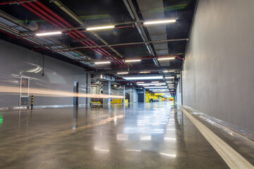 Empty parking garage underground interior in apartment or in supermarket