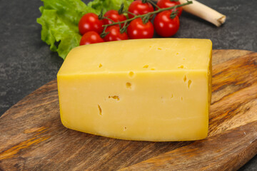 Hard yellow tasty cheese brick