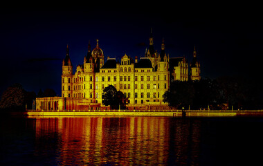 Fototapeta na wymiar Schwerin Castle illuminated at night. Germany