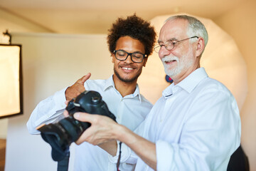 Photo student and senior photographer with camera