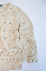 warm knitted wool sweater sleeve white background