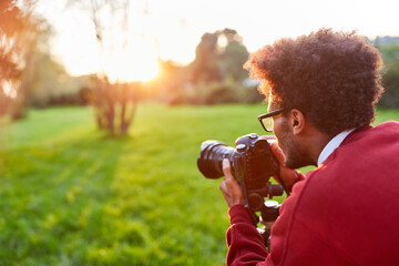 Fototapeta premium Photographer as a landscape photographer taking pictures