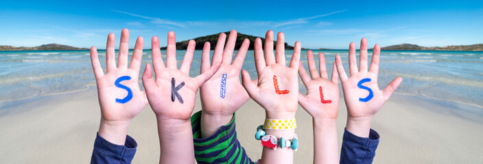 Children Hands Building Colorful English Word Skills. Ocean And Beach As Background