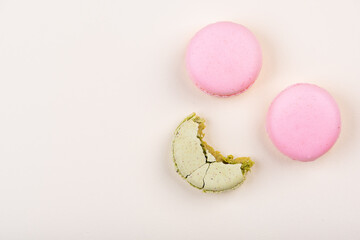 Macaroons on yellow background. Top view.