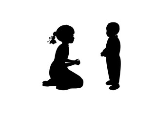 Silhouette sister takes care of little brother