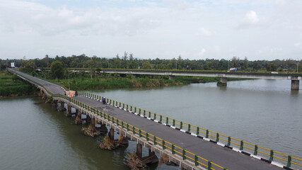 Fototapeta na wymiar Aerial view of Srandakan long bridge that crosses the river Progo. Yogyakarta Indonesia