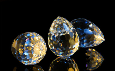 Large faceted crystals on a black reflective surface