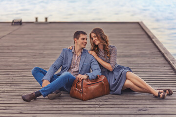 Young couple in love outdoor.Stunning sensual outdoor portrait of young stylish fashion couple posing in summer in street