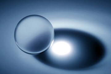 Glass sphere (ball) illuminated by a point light source.