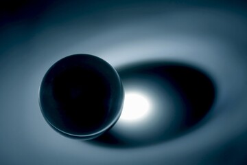 Glass sphere (ball) illuminated by a point light source.
