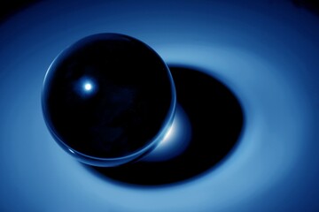 Glass sphere (ball) illuminated by a point light source.