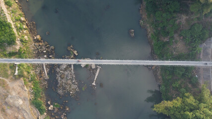 aerial view of a suspension bridge that connects between villages in Bantul. Yogyakarta Indonesia