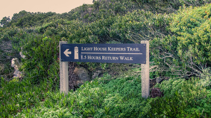Directional sign board located at the cape point shows direction to Lighthouse Keeper's Trail.