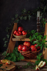 Fototapeta na wymiar Still life with red apples. The dark style. The vertical format.