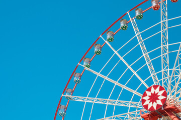 Ferris wheel against the blue sky.