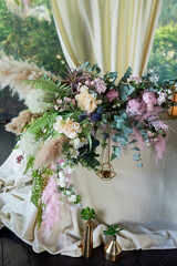 Floral arrangement, for the design of the table of the newlyweds . Light tablecloth, cereals, pampas. Wedding floristry.