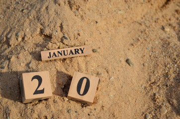January 20, Number cube with Sand pile for a background.