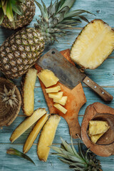 Still life with pineapples on a wooden background. The view from the top.