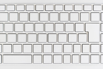 ハイアングルで撮影した白いノートパソコンのキーボード