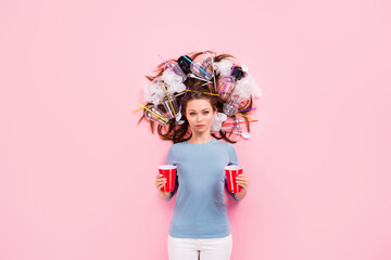 Obraz na płótnie Canvas Top view above high angle flat lay flatlay lie concept of responsible conscious girl with junk in hair holding in hands punch cups solution decision reuse choice isolated pink pastel color background